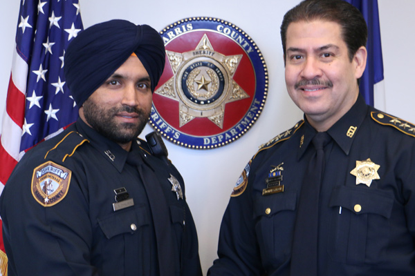 Deputy Sandeep Singh Dhaliwal and Sheriff Adrian Garcia