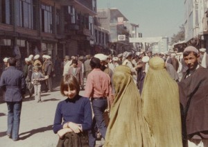 One of my favorite childhood games involved guessing the thoughts of the veiled women I saw in busy streets in Muslim cities. Here I’m standing in a crowded bazaar in Kabul, Afghanistan, and a curious burqaed lady turns toward the camera as she passes by. Later, as a journalist, I had returned to Kabul and wore a burqa in order to remain undetected as a foreigner, and I reported on life under Taliban rule.  (photo courtesy Carla Power) 