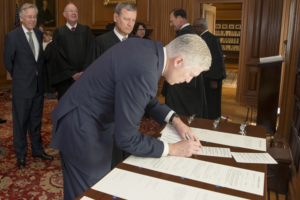 Judge Neil M. Gorsuch signs the Constitutional Oath in the Justices' Conference Room, Supreme Court Building -April 10, 2017.