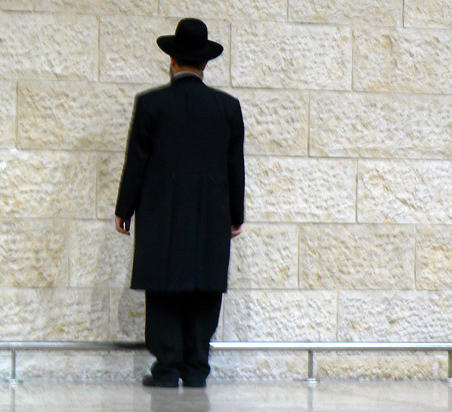 Rabbi facing wailing wall