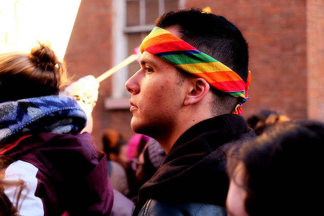 Man wearing rainbow bandana