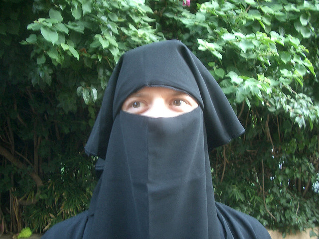White woman wearing burka