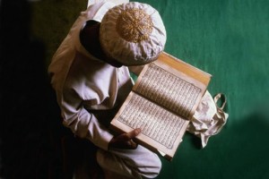 Muslim Boy Reading The Qu'ran