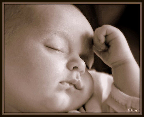 close up of a baby that is sleeping