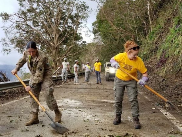 Working alongside the army to clear debris from a road in Puerto Rico