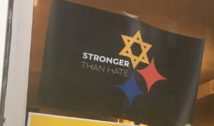 Posters on the window of a coffee shop on Murray Avenue at Squirrel Hill, in response to the Pittsburgh synagogue shooting.