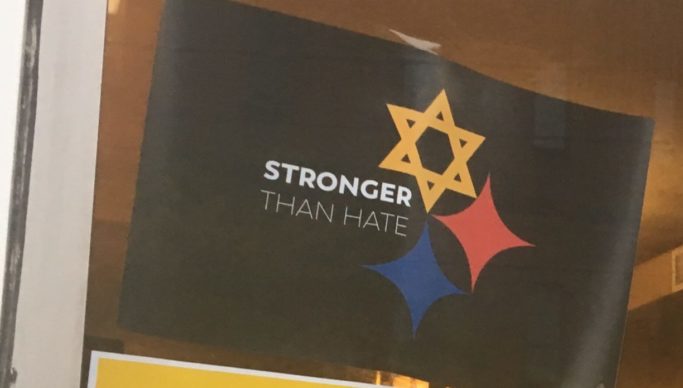 Posters on the window of a coffee shop on Murray Avenue at Squirrel Hill, in response to the Pittsburgh synagogue shooting.