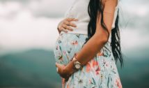 Pregnant lady holding belly. Free public domain CC0 photo.