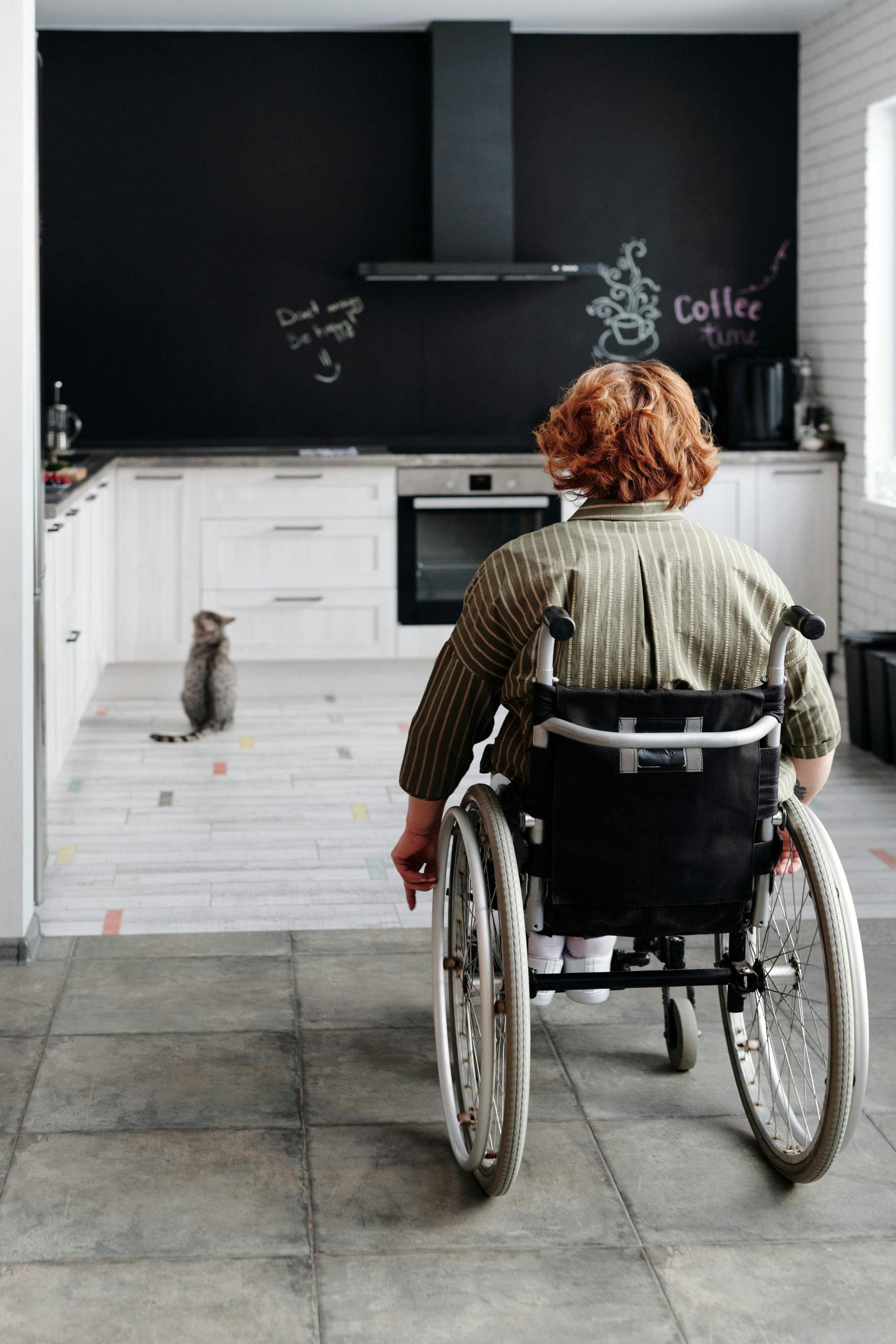 Woman Sitting on Black Wheelchair