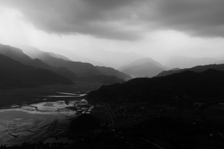 a black and white photo of a mountain range
