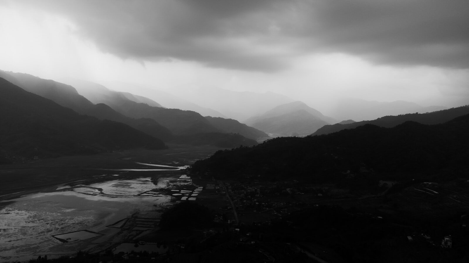 a black and white photo of a mountain range