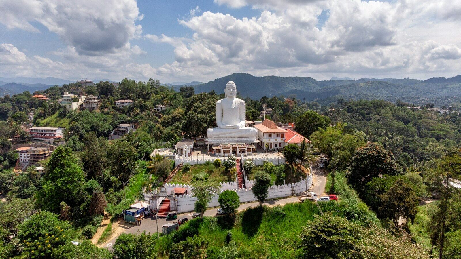 Gautama Buddha statue under white clouds